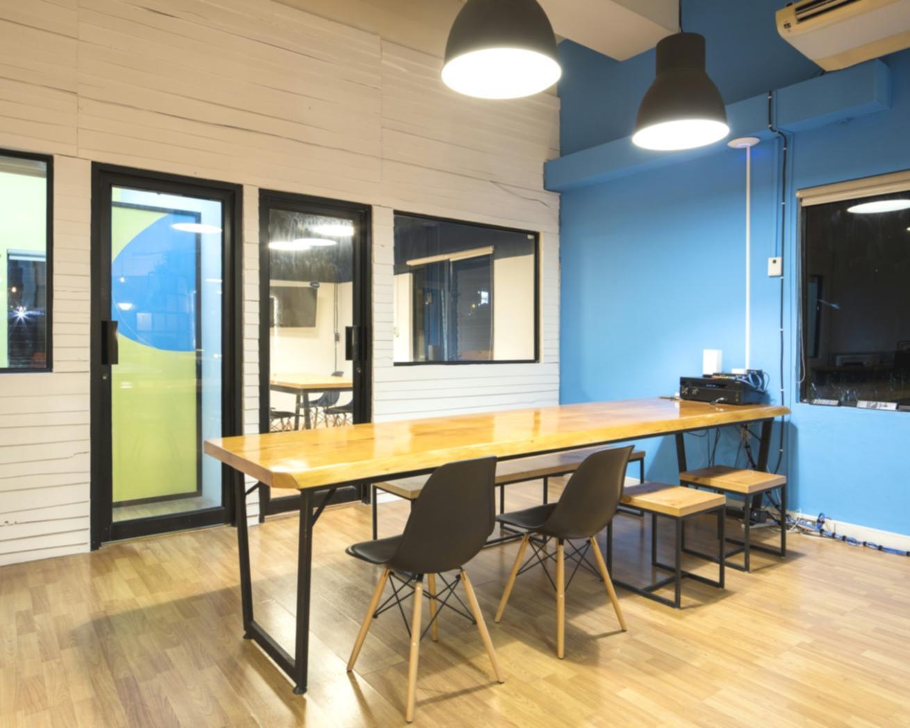 Professional financial workshop with participants analyzing market data and valuation frameworks