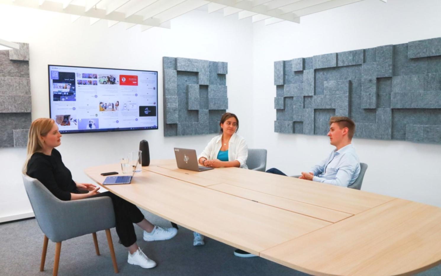 Financial analysts reviewing valuation models on computer screens