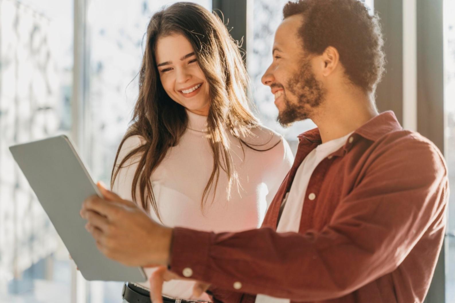 Financial analysts reviewing complex valuation models on multiple monitors